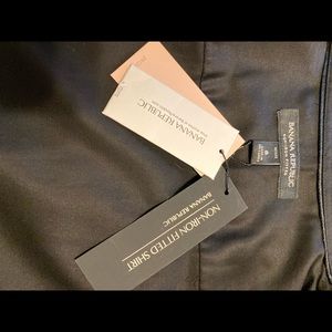 Black non-iron fitted blouse.